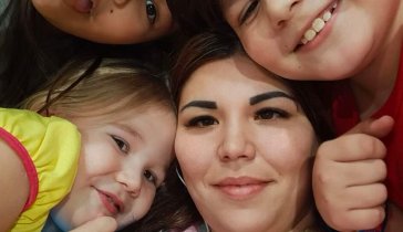 Lyudmila mother of three children help with closing one of the loans.